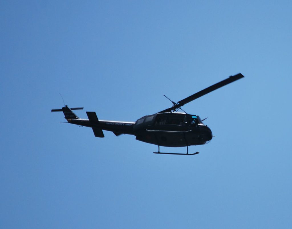 A former US military helicopter flying over Kellys Beach.
