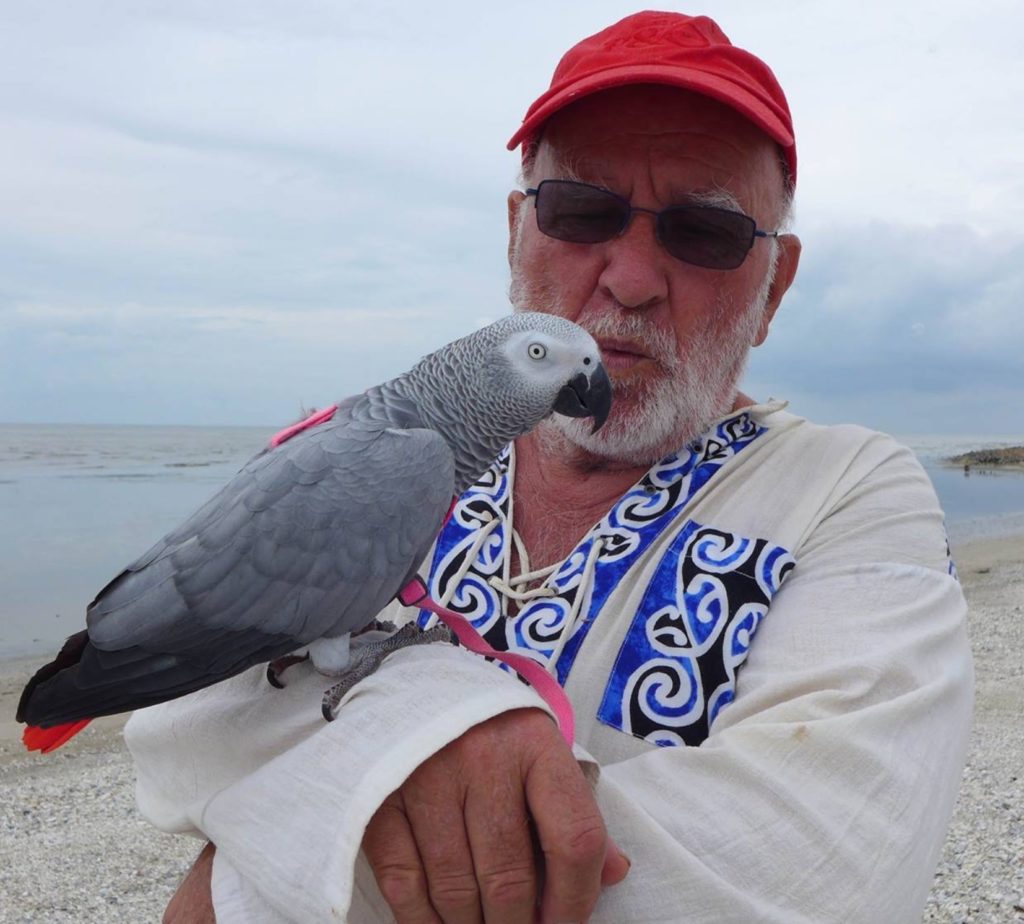 Parrot expert John Kluth with an African Grey Parrot