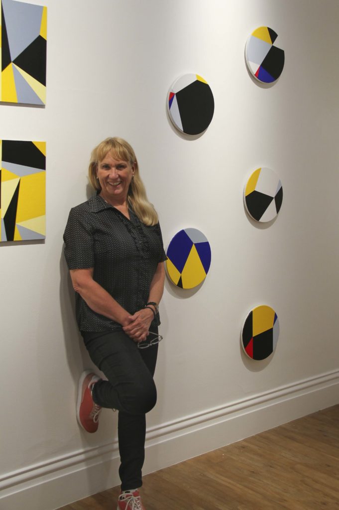 Judith Duquemin with her exhibition Geometry and Place at Bundaberg Regional Art Gallery.