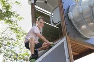 Tane Hart climbing the Botanic Gardens slide tower.