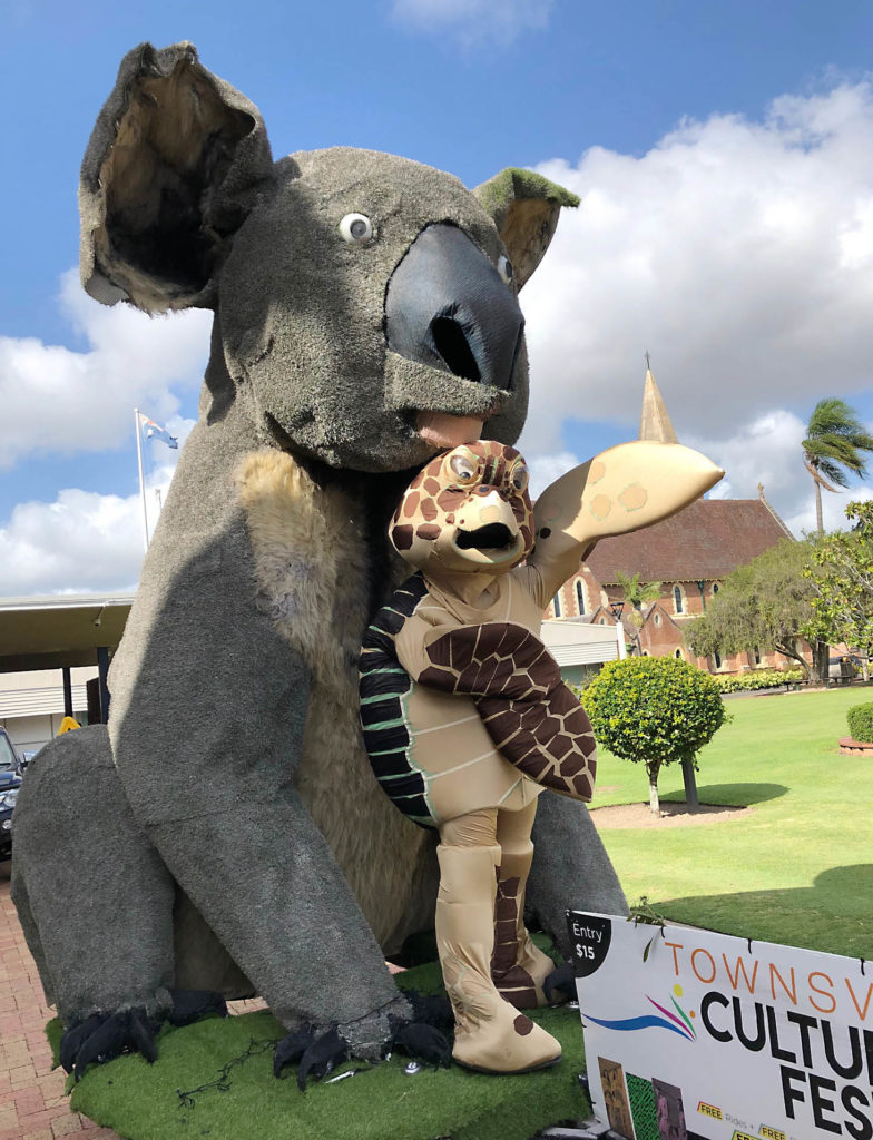 Bundaberg's "Flip" the Reading Turtle was on hand to greet the 4.5 metre high koala visiting the region on its journey to Townsville