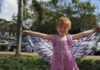 Indi McPhilomey 'flying through nature' in Buss Park ahead of the free Epic Earth Day event. The butterfly wings will be a part of the morning's activities.