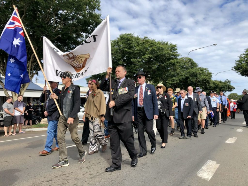 Woodgate Anzac reflection, ex service personnel marching in Childers.