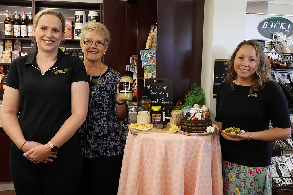 Council's Community Services portfolio spokesperson Cr Judy Peters (middle) joins stallholders Leisa Storey, from Nana's Pantry, and Melissa Baker, from Well Goodness Me, to launch the 2019 Bundy Flavours event.