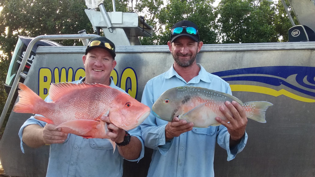 Dale Smith with a red emperor and Scott Svensson with a parrot fish.