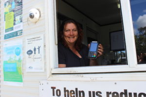 Landfill attendant Marcie Petterson with the new eftpos machine at University Drive Waste Facility