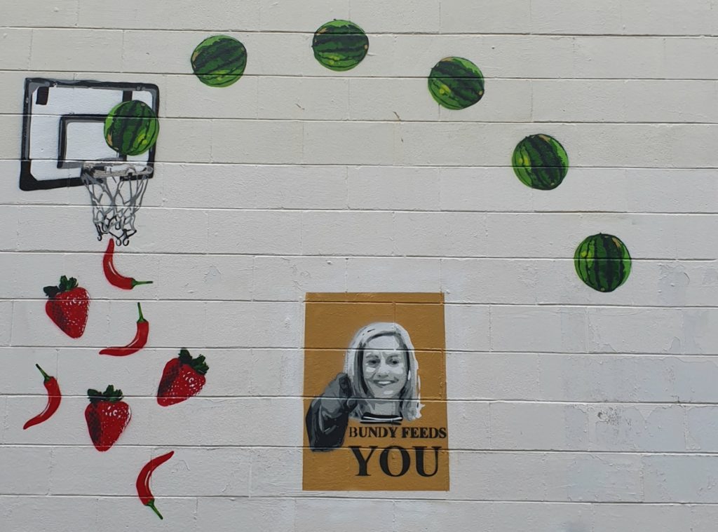 Team Snipz street art in Bundaberg featuring Suzie Clarke and the words Bundy Feeds You.