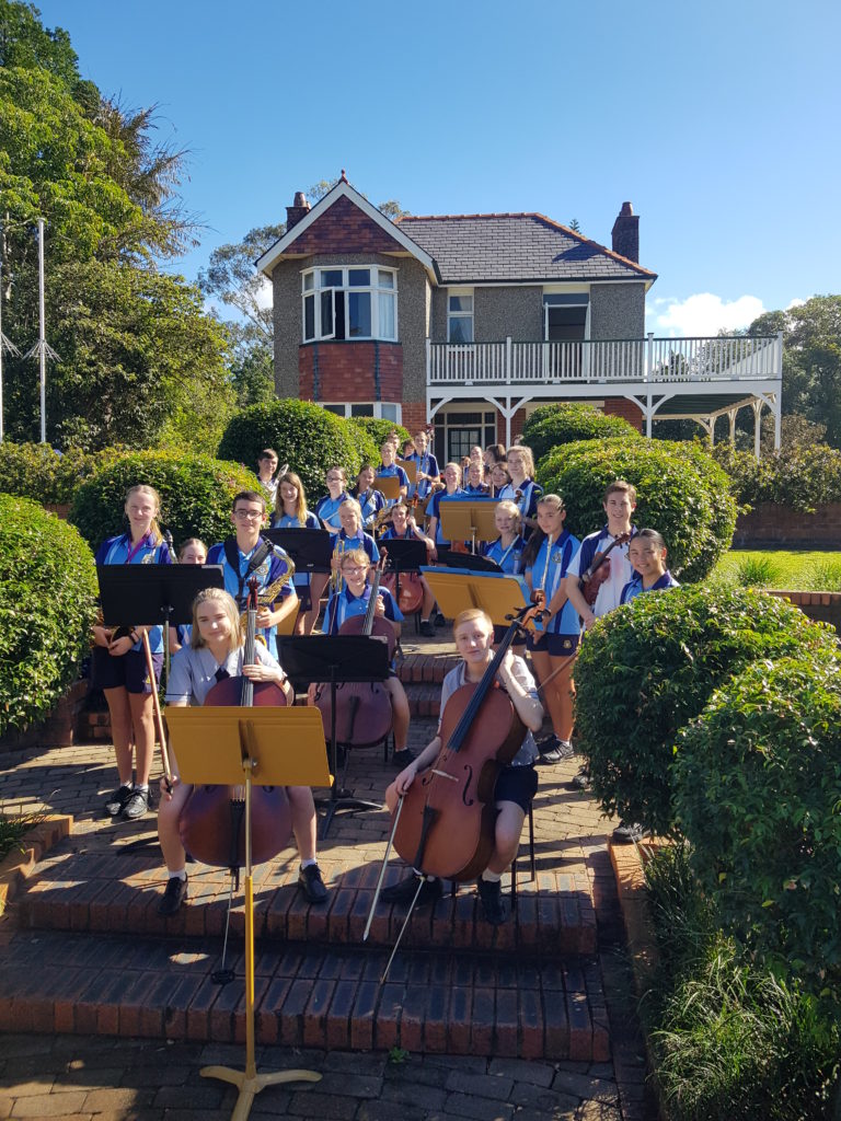 Bundaberg State High School students performing in front of Bert Hinkler's house