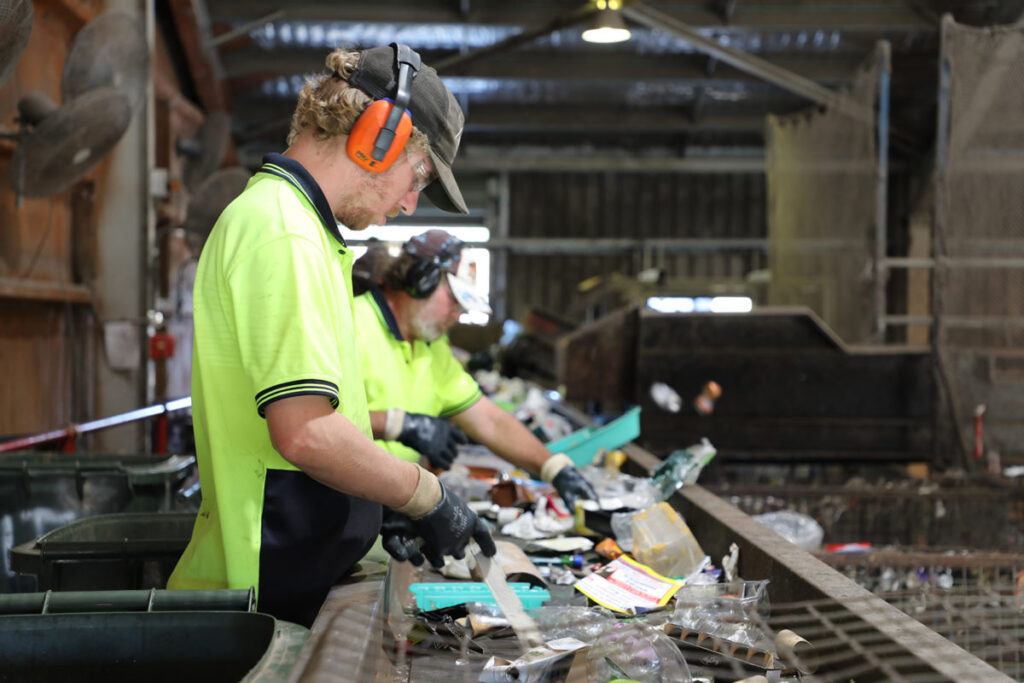 The sorting process begins by by Impact Community Services staff  at the Material Recovery Facility.