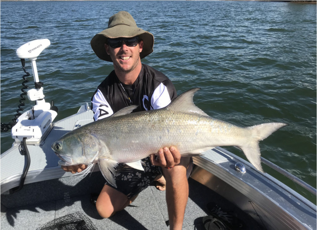 Jack Bartholdt with a 95cm blue salmon he caught in the Burnett River. 