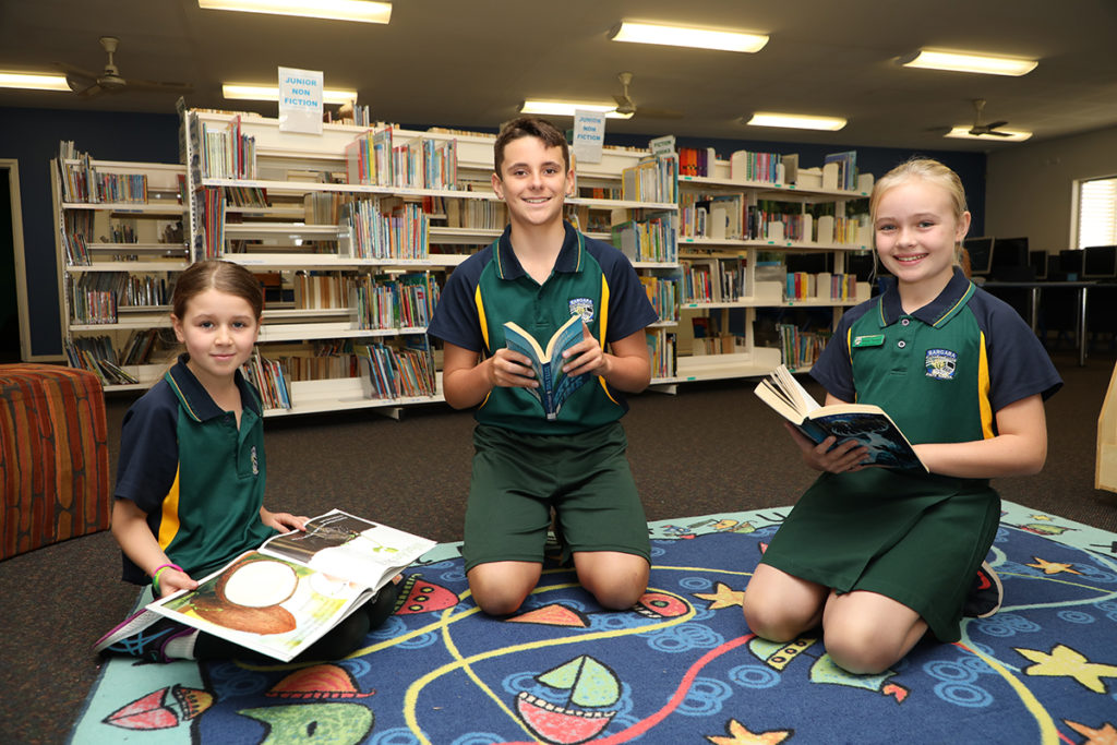 Hailey Randell, Tommy Zunker and Makyla Thompson love their reading at Bargara State School Library.