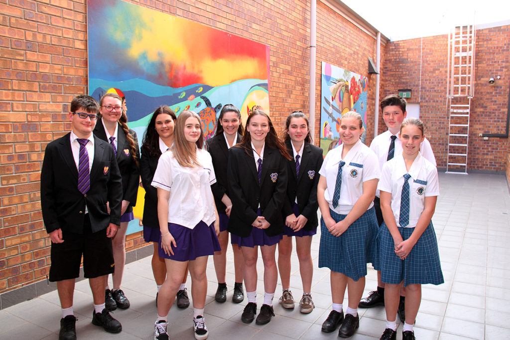 Friendly mural: North Bundaberg High School and Bundaberg Christian College Students with their artwork at the Friendlies hospital.