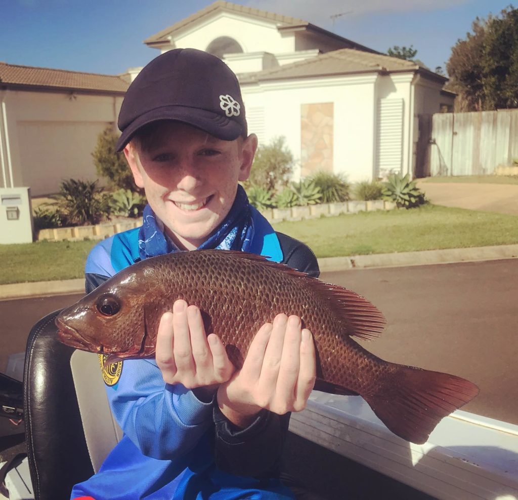 Kayden Stoddart with a mangrove jack.