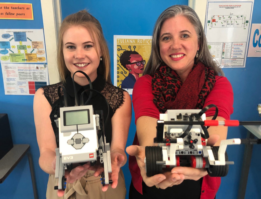 Bundaberg East State School's Melinda Clancy and Kalkie State School's Samantha Ephraims with the robots they use in the classroom.