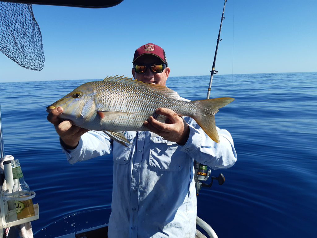 Dale Smith with a yellow sweetlip caught recently offshore.
