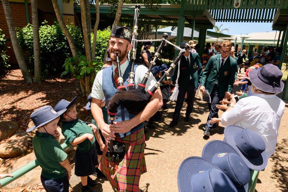 Pipe Major Kyle enjoying leading the Grade 12 Graduates at St Luke’s in 2018.
