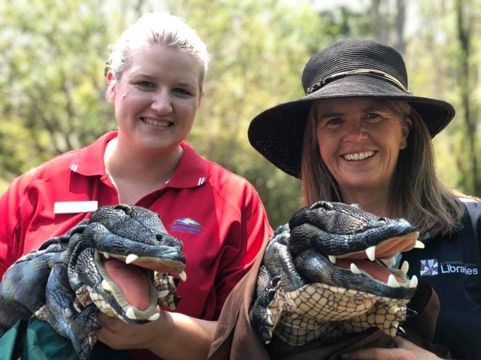 Bundaberg Regional Council's Hayley Martell and Sharon Millett with the crocodile twins.