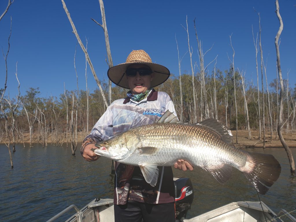 Thomas Chadwick with the 83cm barramundi he caught at Lake Monduran