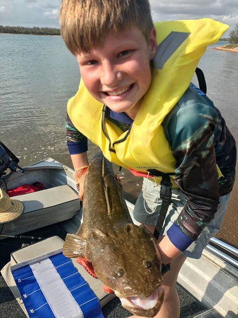 Harlan Bignell with the 89cm flathead he caught and released recently.