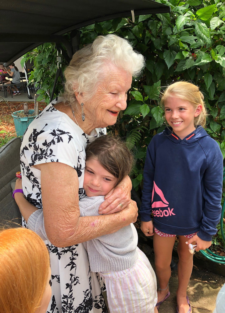 Priceless. Barb receives a hug from Miley Ludke following a visit to the Fantasy Garden.