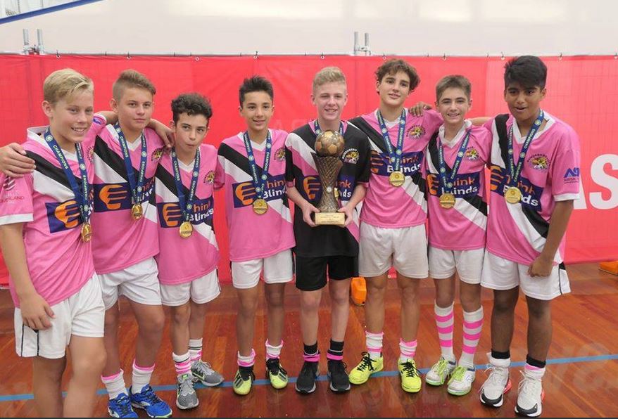 The Under 13 Boys Wildcats Bundaberg Futsal team with their trophy.