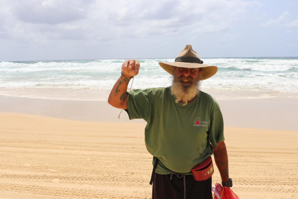 Ray Smith with his first ever beach worm at Fraser Island.