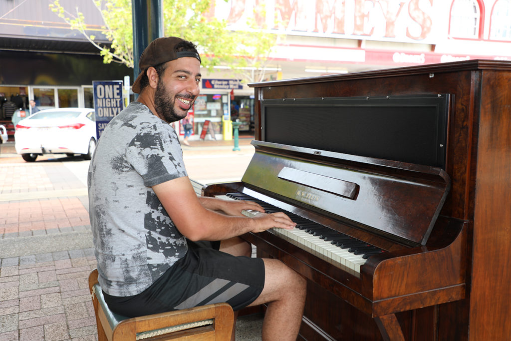 Malek Kas from Paris checks out the new community piano in the Bundaberg CBD.