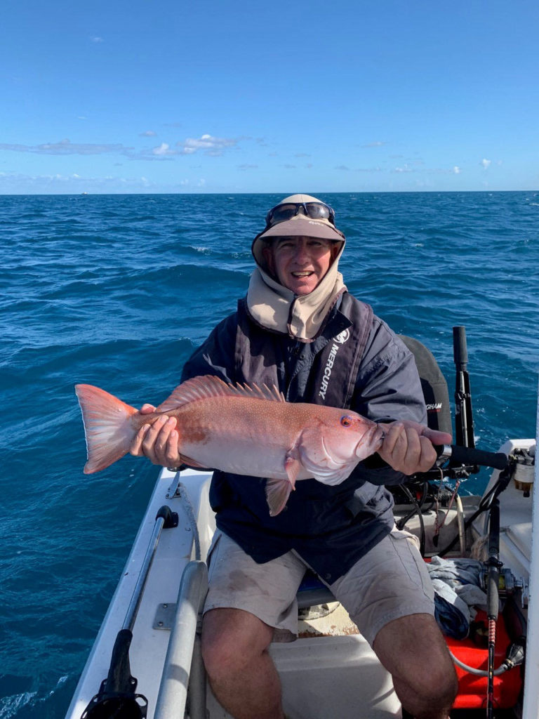 Peter Baxter with his 57cm personal best coral trout he caught recently.