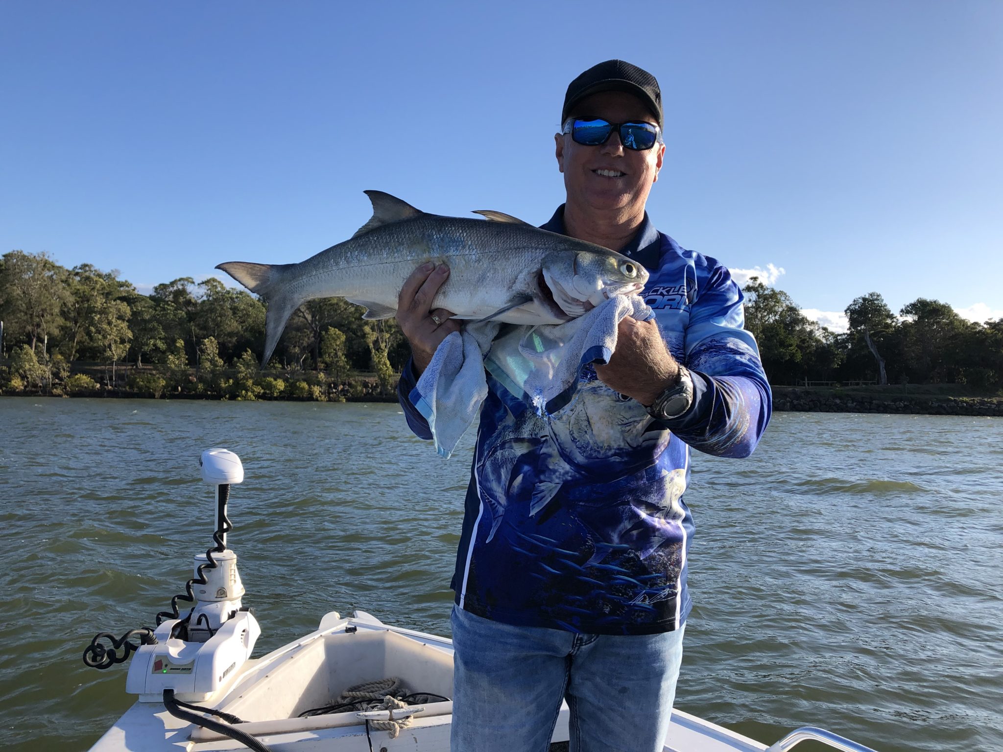 Shane Anderson with the 67cm blue salmon he caught in the Burnett River last weekend.