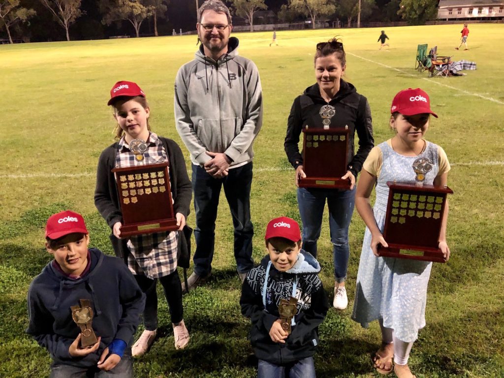 Age group champions at the Isis District Little Athletics for the 2019-20 season are (from left) Jake Hardy and Alicia Ebert (Juniors); Michael Ebert and Charli Murton (Seniors) and Martyn Ryan and Emily Hardy (Adult).