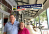 Graham and Joanne Walker with a sign of the times. Once printed newspapers were the hub of their newsagency business.