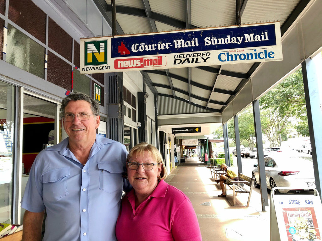 Graham and Joanne Walker with a sign of the times. Once printed newspapers were the hub of their newsagency business.