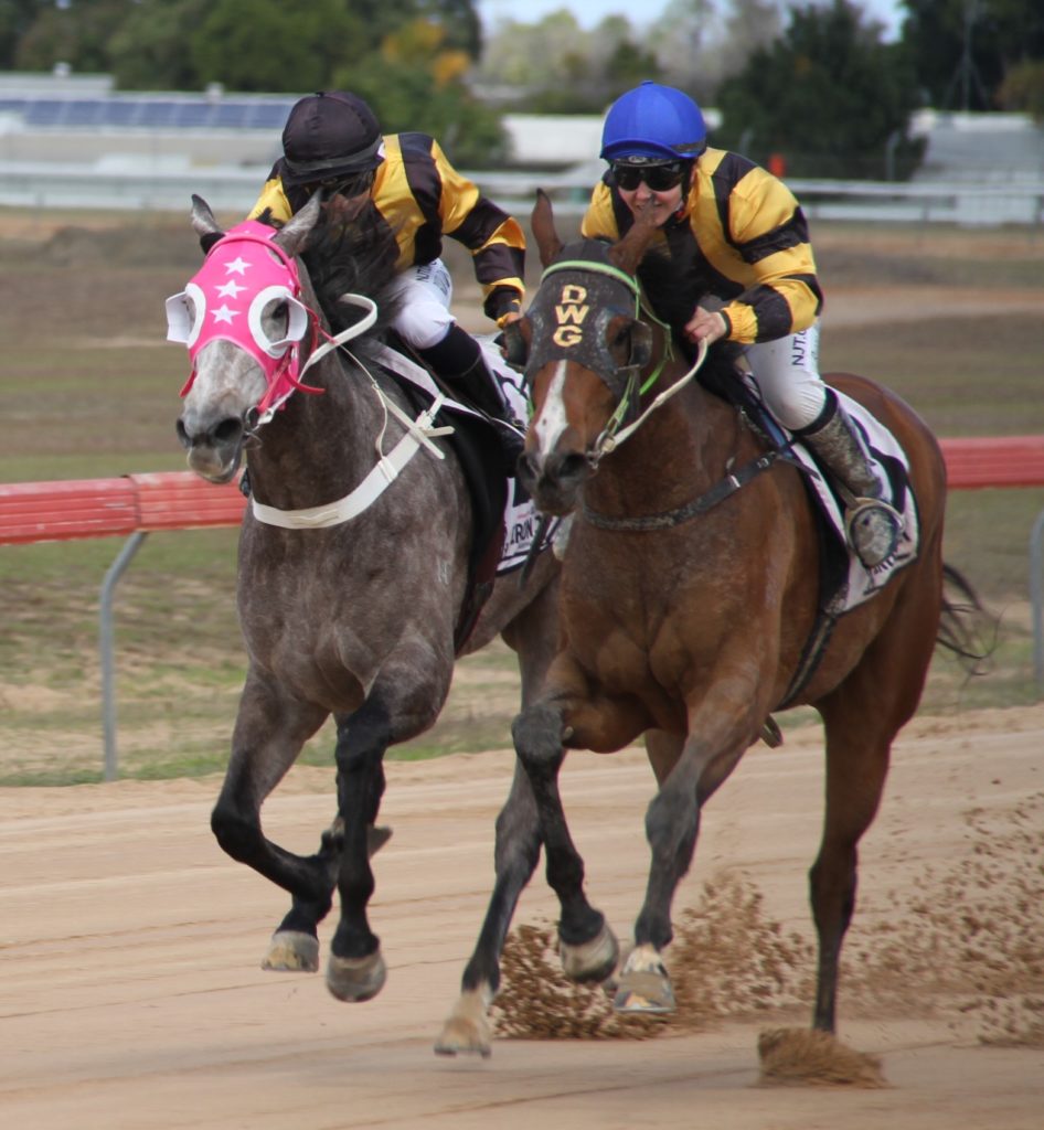 Apprentice Rebecca Wilson rides Dolci (right) to edge out Shenzi (Hannah Richardson) in the Class B Handicap.