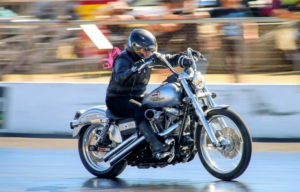 Flame Howard on her Harley headed for another slick time at Benaraby Dragway.