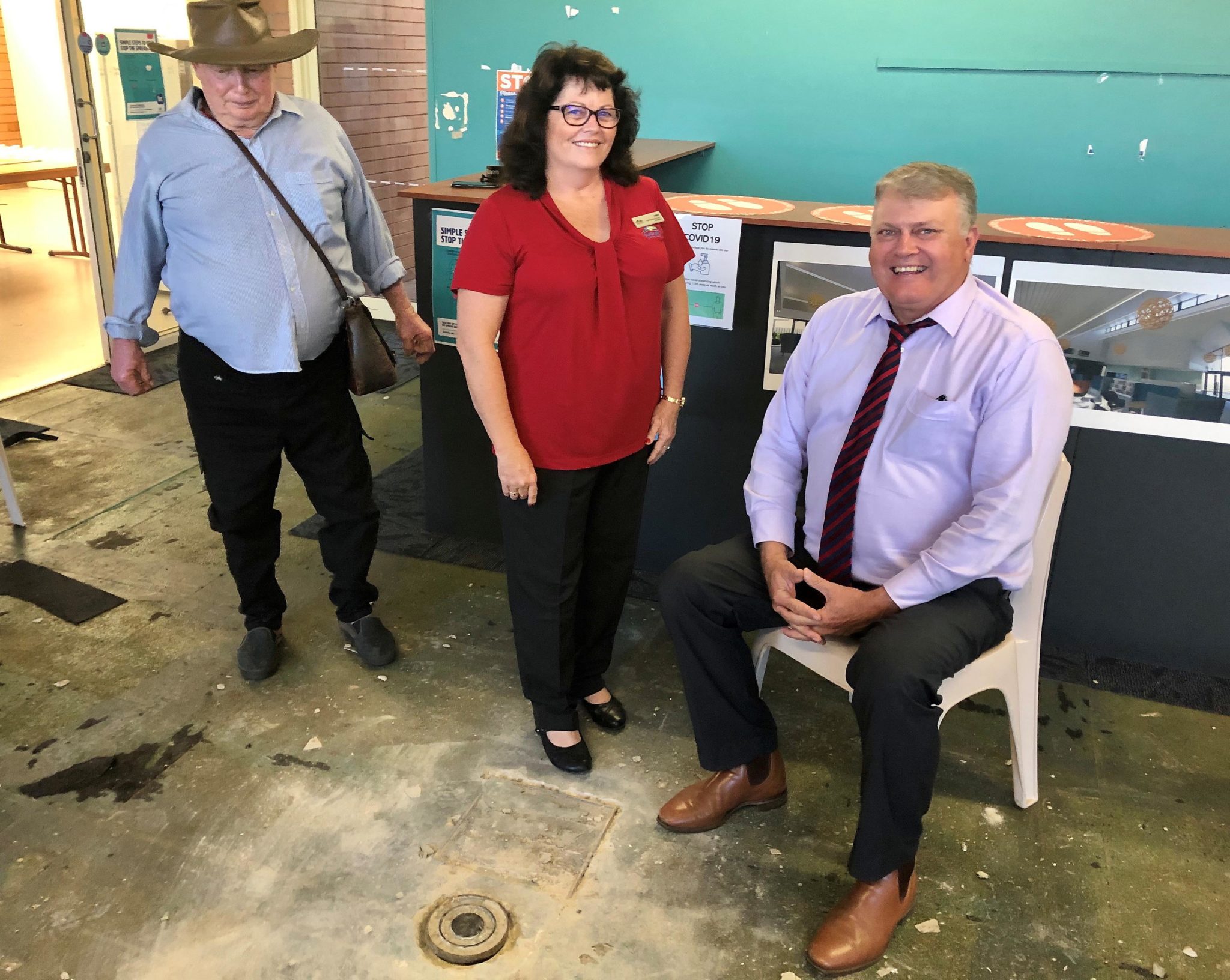 Retrieving the Kolan Centenary Time Capsule from the floor of the former Gin Gin Neighbourhood Centre brought back memories for (from left) Herb Aulfrey, Amber Larsen and Cr Wayne Honor. The capsule will be secured for a further 59 years.