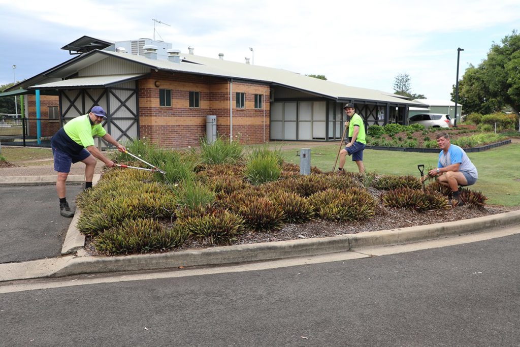 Ray from the Community Centre with Jason and Jacob from Council maintain the gardens.