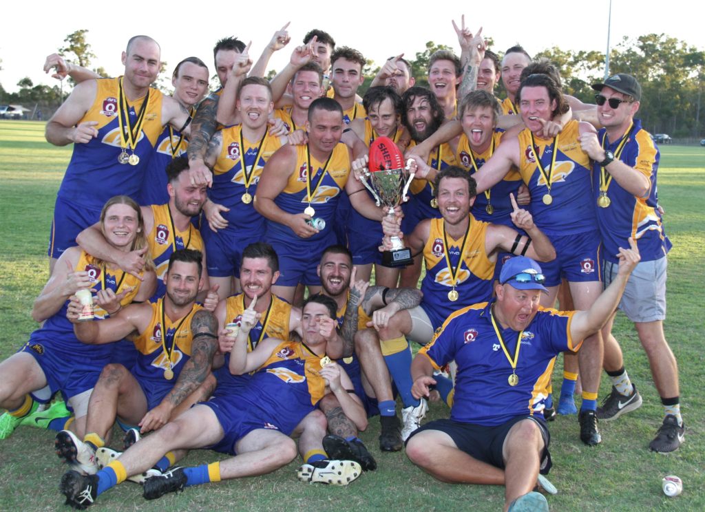 Across The Waves Eagles celebrate their AFL Seniors grand final victory – Players: Ethan Hawkins, Max Wright, Mitch Wright, Jayden Forrestall, Ryan Paterson, Karl Williams, Dean Nelson, Michael Blair, Jared Everett, Damon Wood, Patrick Power, Codie Welsh, Jayden Welsh, Codey Enever, Jake McInerney, Tim Dart, Jason Bethune, Jesse Lawrence, Nathan Van Eekeren, Damian McRae, Jayden Enever, Michael Sommer-Liverton, Cody Woodrow, Ben Wright.