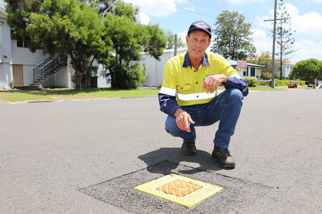 Bundaberg Regional Council's Ian Laing with a water hydrant.