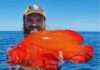 Nelson Phillips with a rare tomato cod caught off Bundy