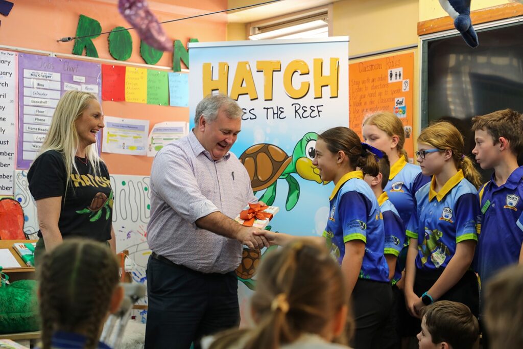 Hatch Saves the Reef spread environmental message