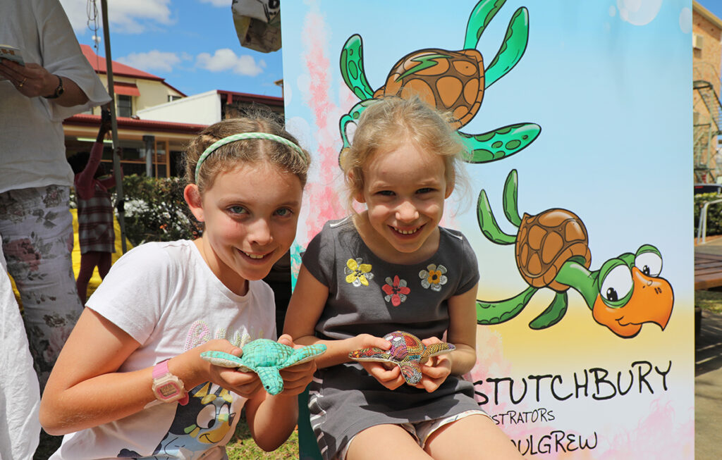Georgia and Katia Strohfeldt with their turtles at the Hatch Saves the Reef book launch.