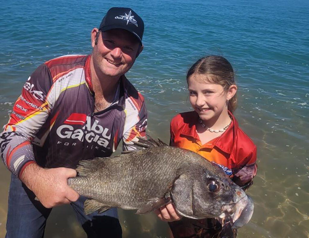 Kalista Hillyard and her dad Scott Hillyard with a big thicklip she caught up at Baffle Creek during the holidays.