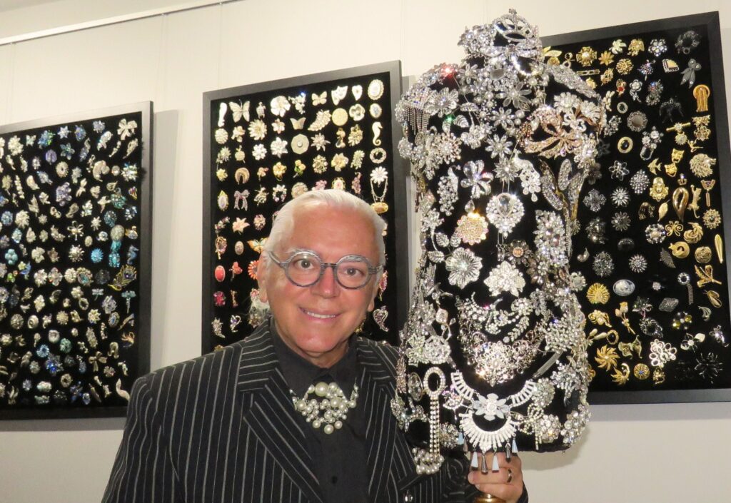 Trevor Green proudly shares his brooch collection in a foyer exhibition at the Moncrieff Entertainment Centre.