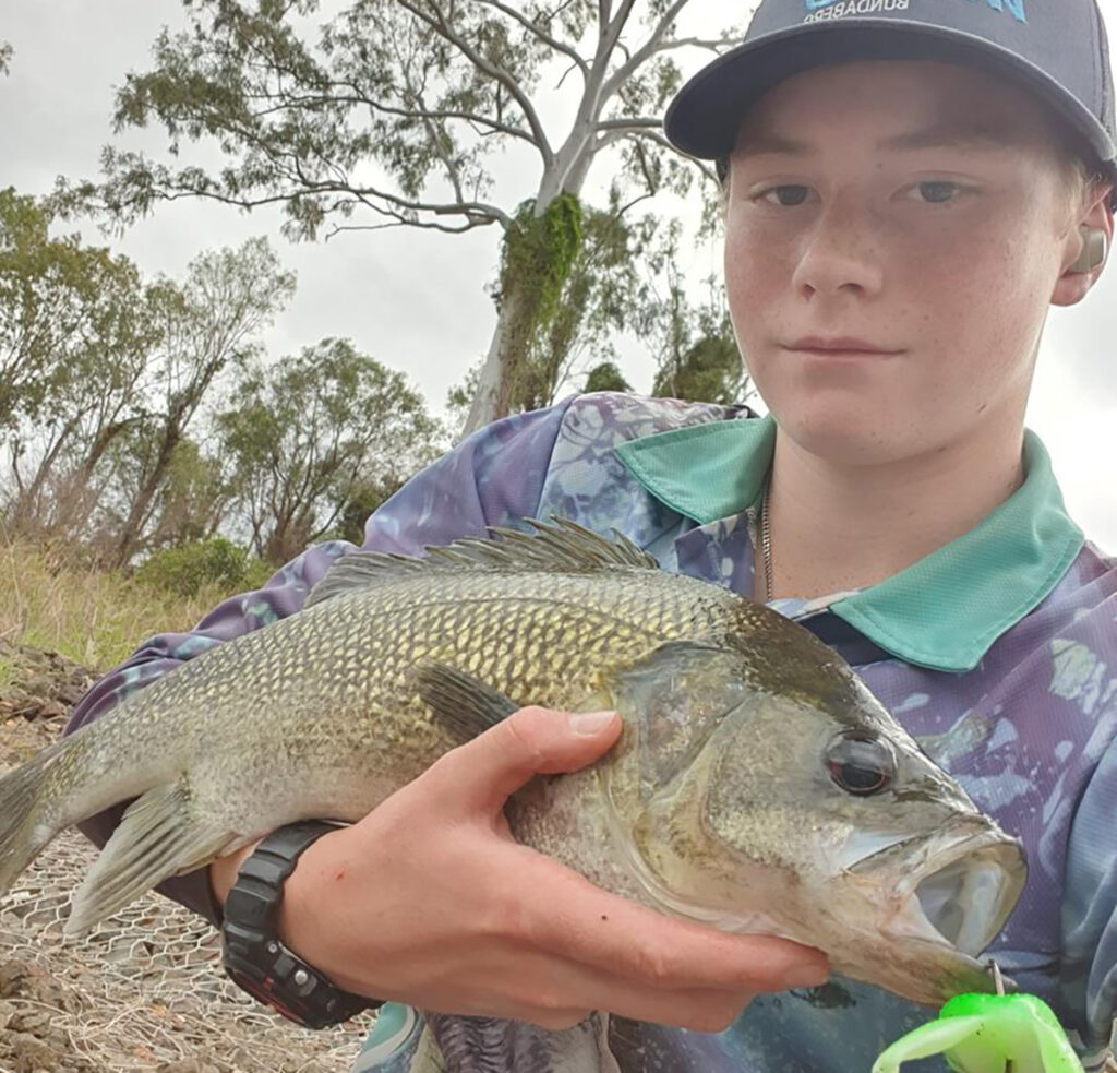 Junior team member Zander with a big 53 cm bass caught on a topwater Chasebaits Flexi Frog.