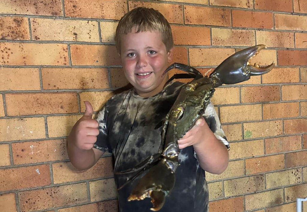 Nathaniel Tindel with a solid mud crab