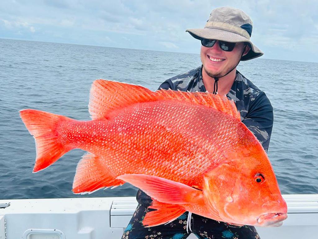 Blake Marschall with a donkey of a red weighing in at 12.8kg.
fishing holiday period