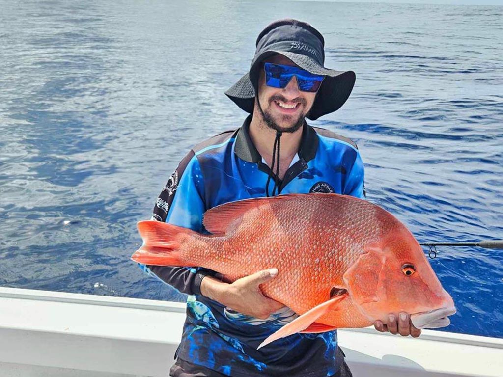 Brock Honor with a solid 80cm red caught off Bundaberg.