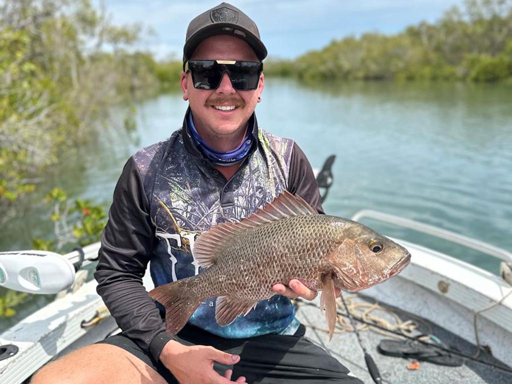 Jacob Green with a 47cm mangrove jack.
fishing holiday period