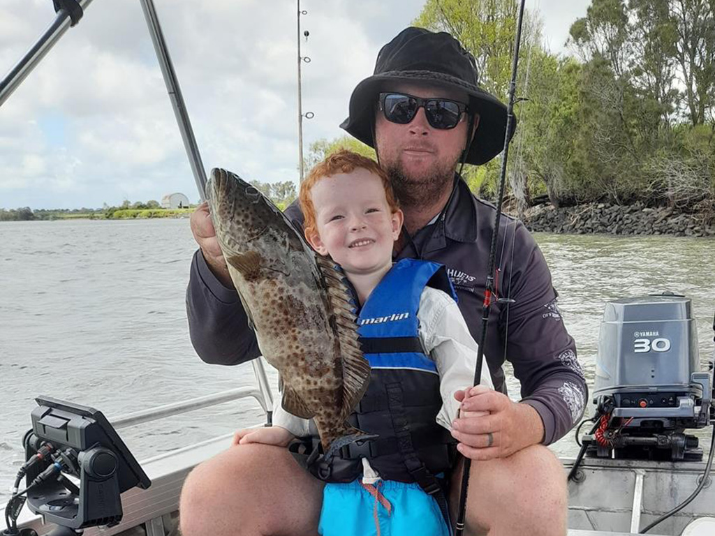 Michael Cogill and his son Jack with a solid estuary cod. quality inshore fishing