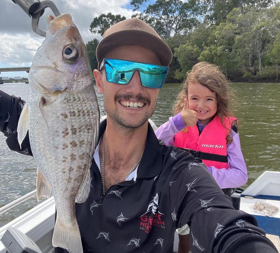 Delilah McMonigal with her first ever fish.